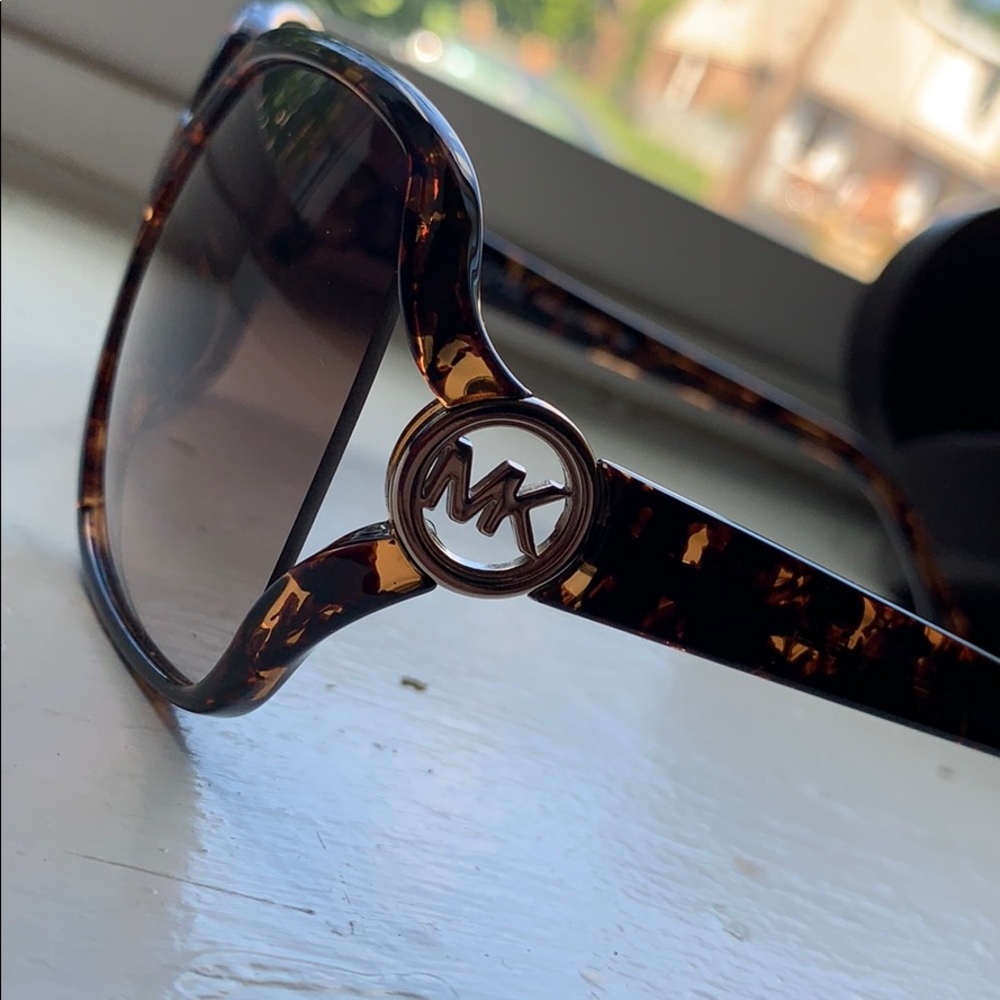 Micheal Kors cheetah print woman’s glasses